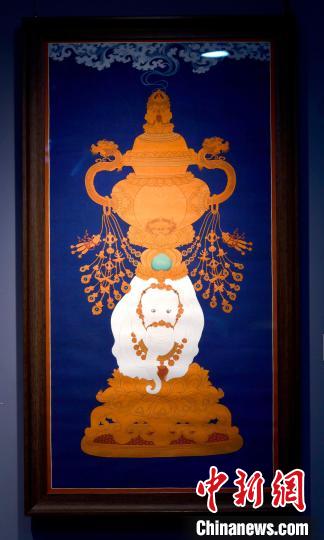 圖為5月16日，展覽中的新創(chuàng)唐卡作品《瑞象承香》?！±盍?攝